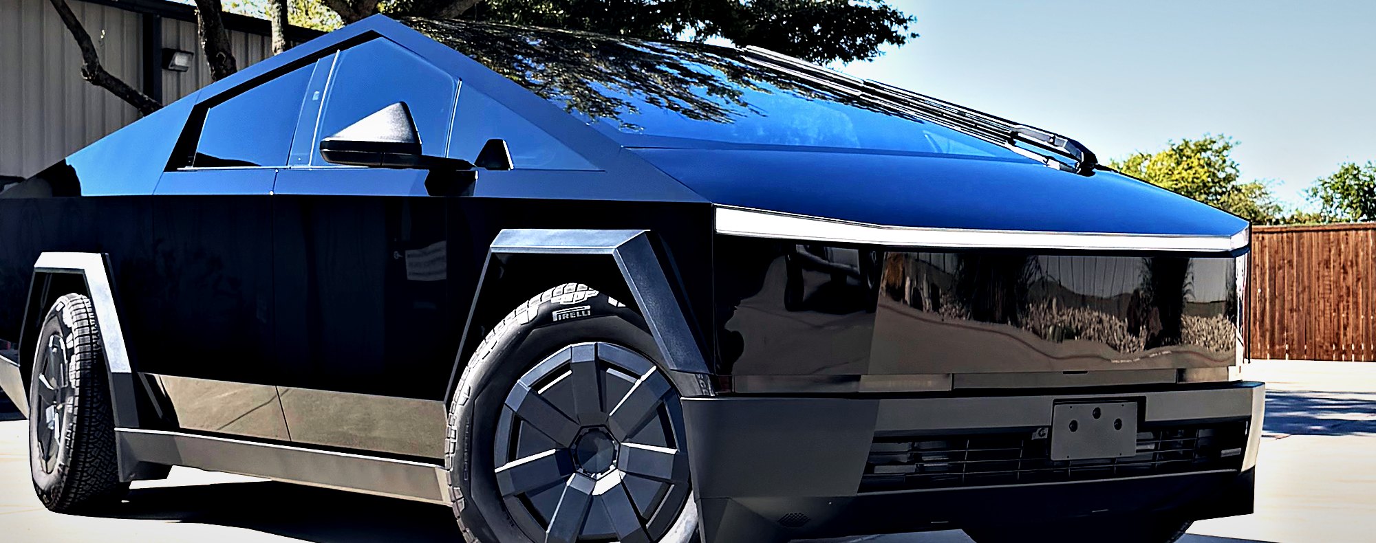 Tesla Cybertruck wrapped in colored gloss black paint protection film