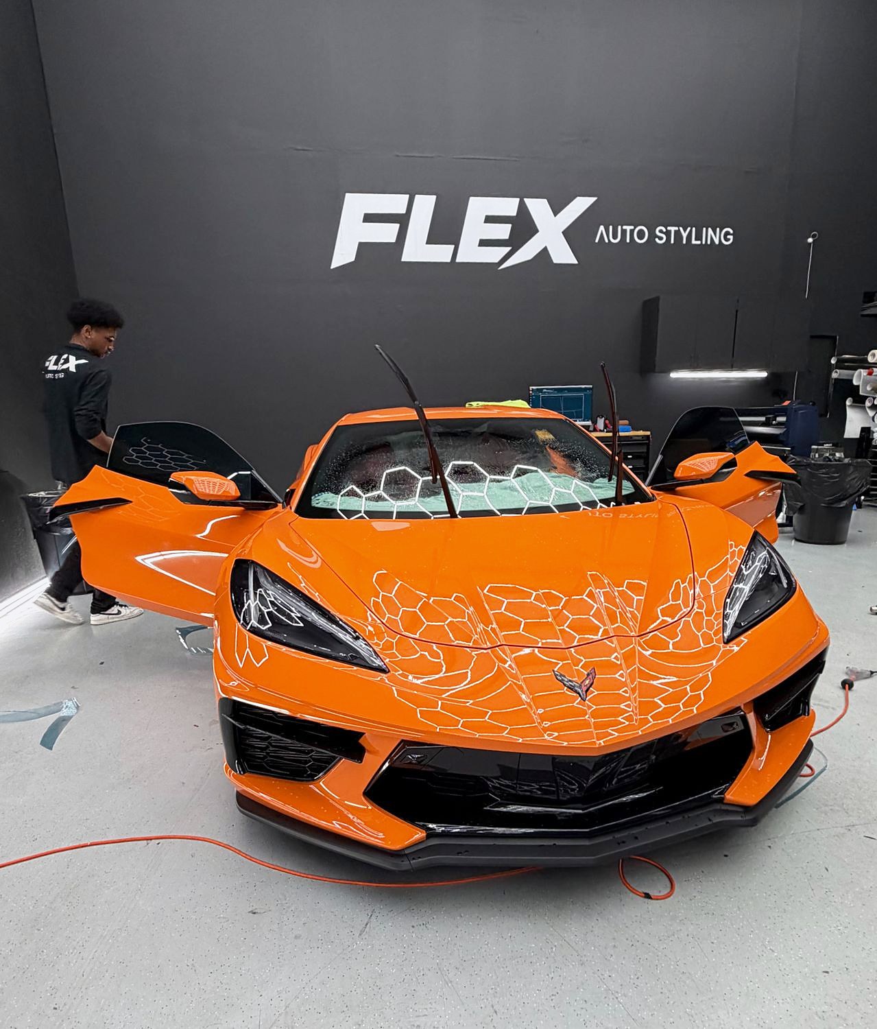 Orange Corvette with paint protection film in the FLEX shop