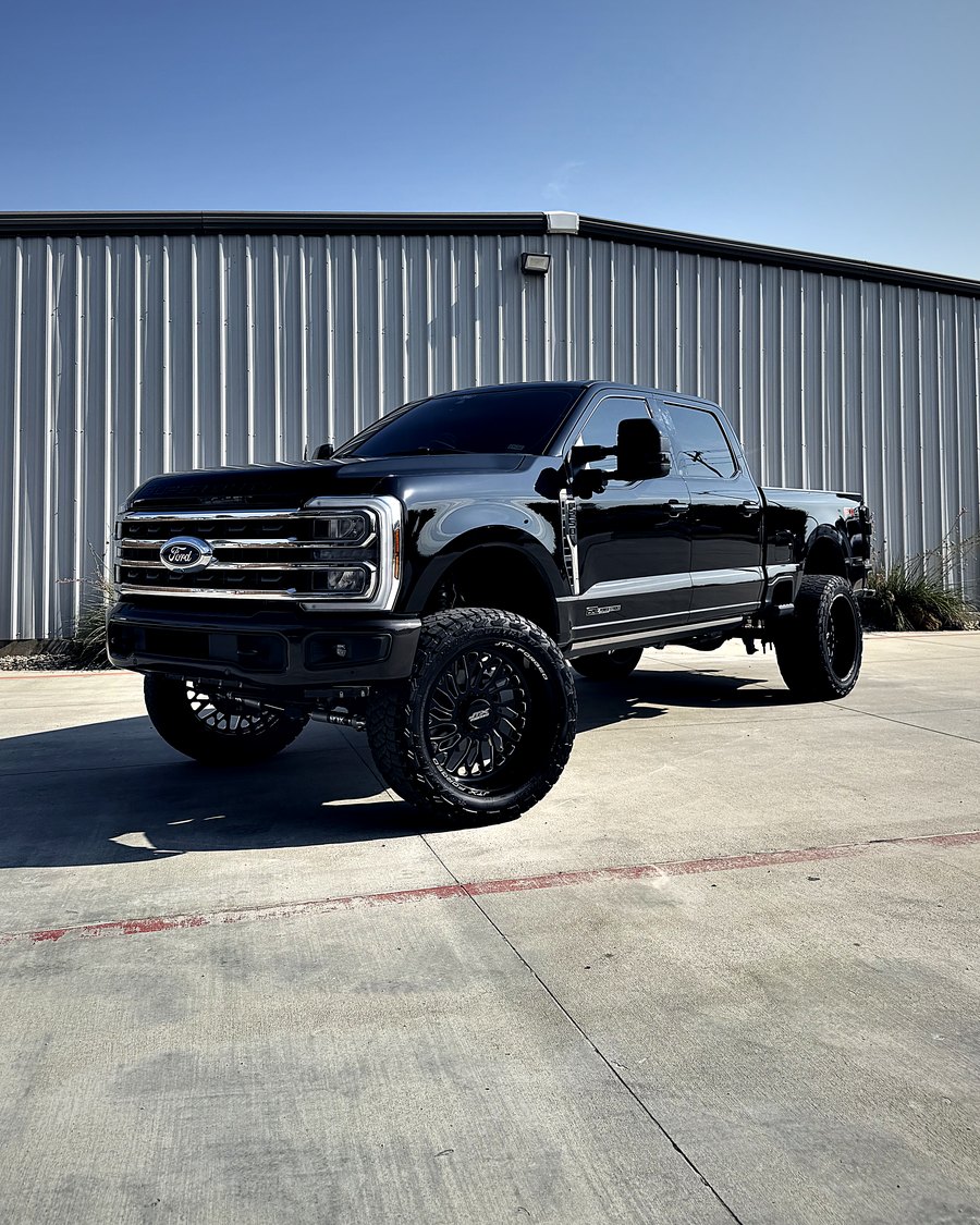 Lifted black Ford Super Duty tinted by FLEX